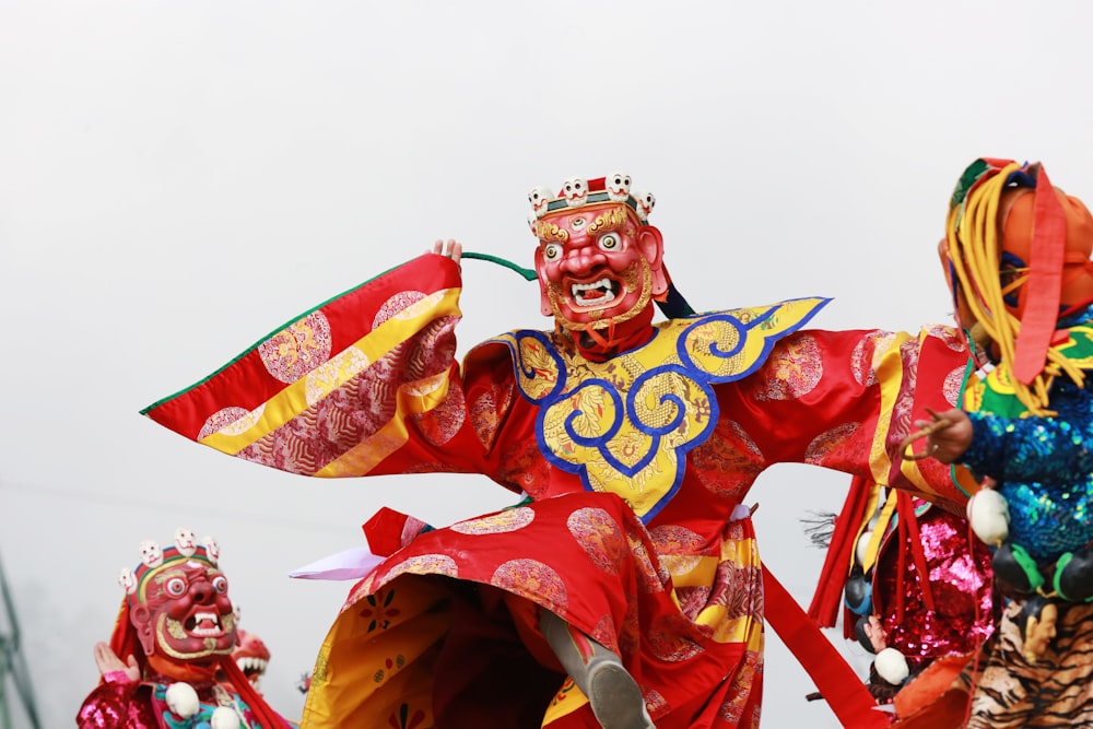 person in red and gold traditional dress