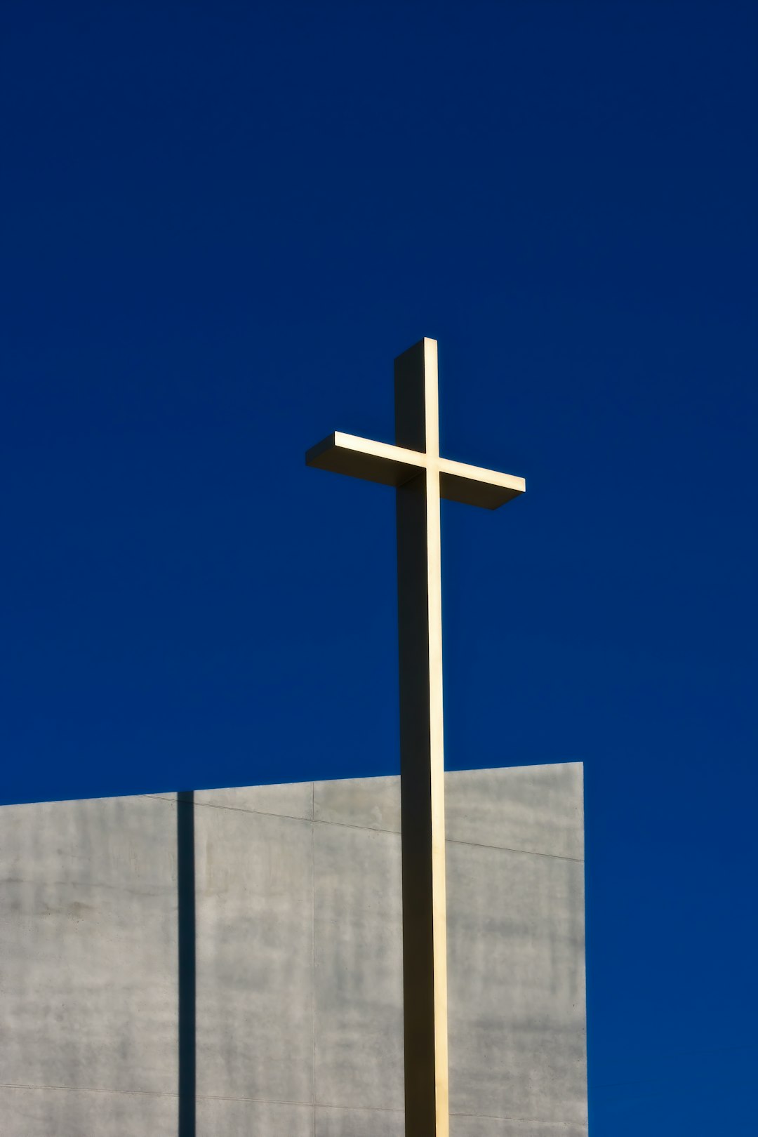 brown cross under blue sky during daytime