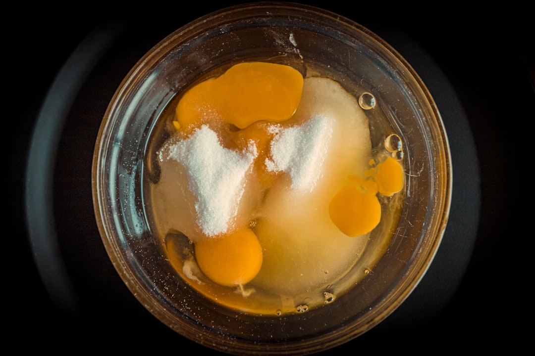 orange and white liquid in clear glass container