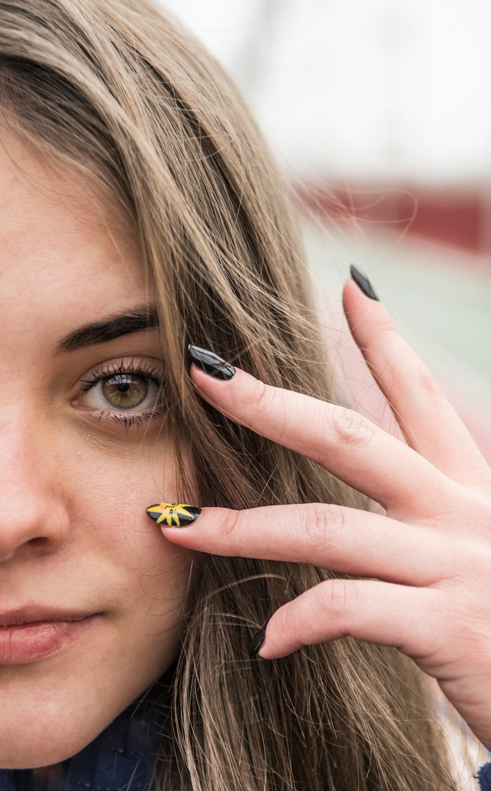 woman with yellow and black ring on her left eye