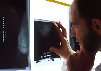 person holding black tablet computer