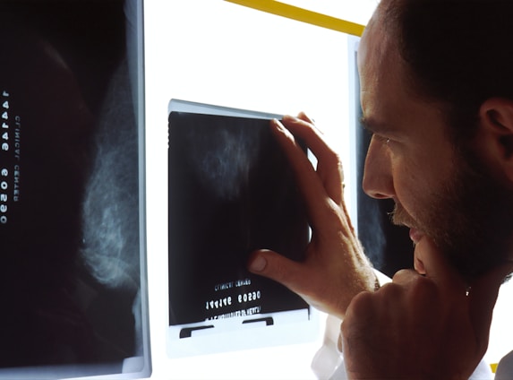 person holding black tablet computer