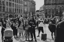 A snapshot of a vibrant public space with people engaging in everyday acts of kindness.