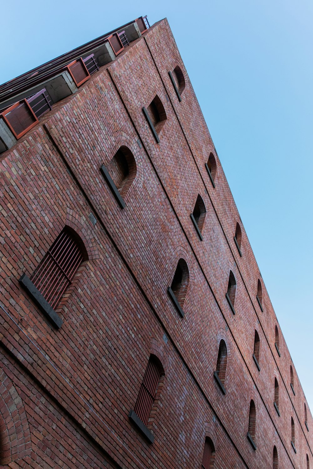 brown concrete building under blue sky during daytime