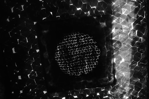 Artistic print featuring abstract honeycomb shapes in electric amber tones.