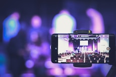 black smartphone taking photo of city lights