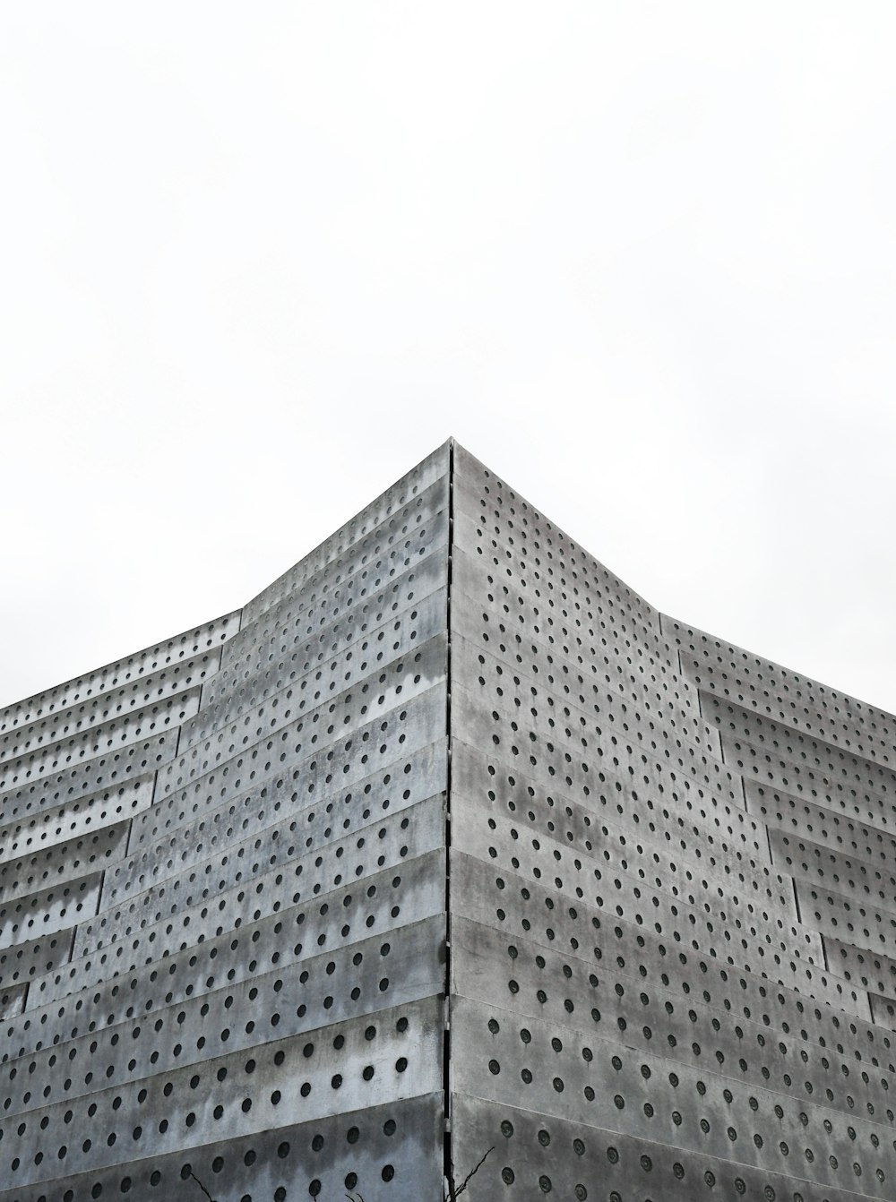 gray concrete building under white sky during daytime