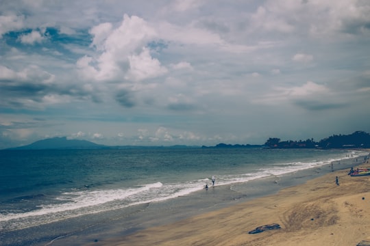 people on beach during daytime in Anyer Indonesia