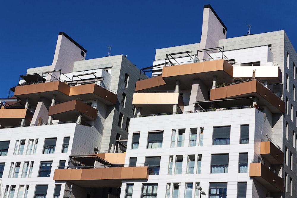 white and brown concrete building under blue sky during daytime