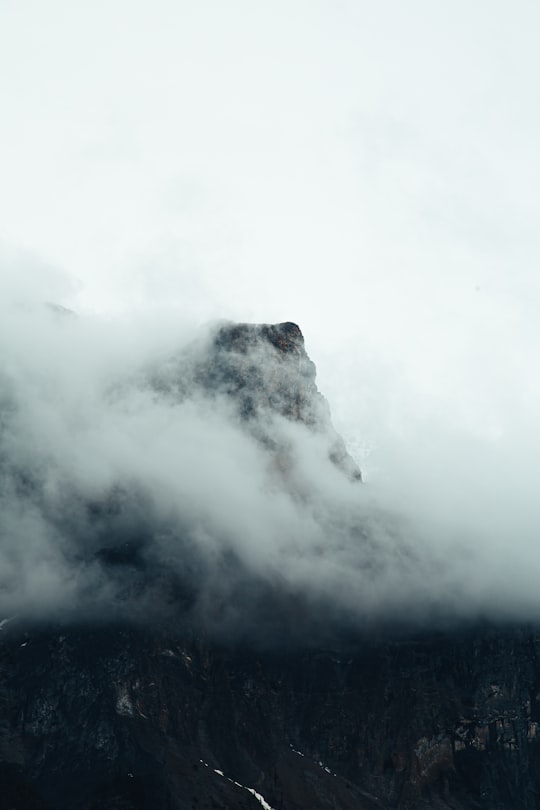 white clouds over black mountain in Yoho National Park Canada