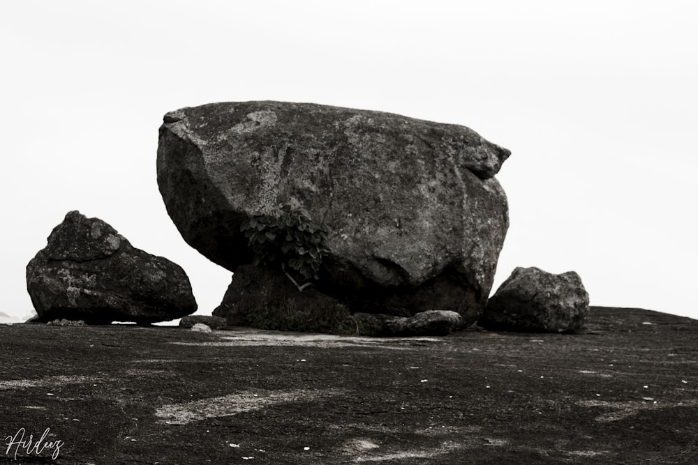 gray rock formation on brown sand during daytime