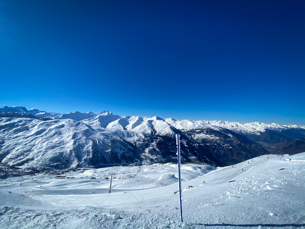 snow covered mountain under blue sky during daytime