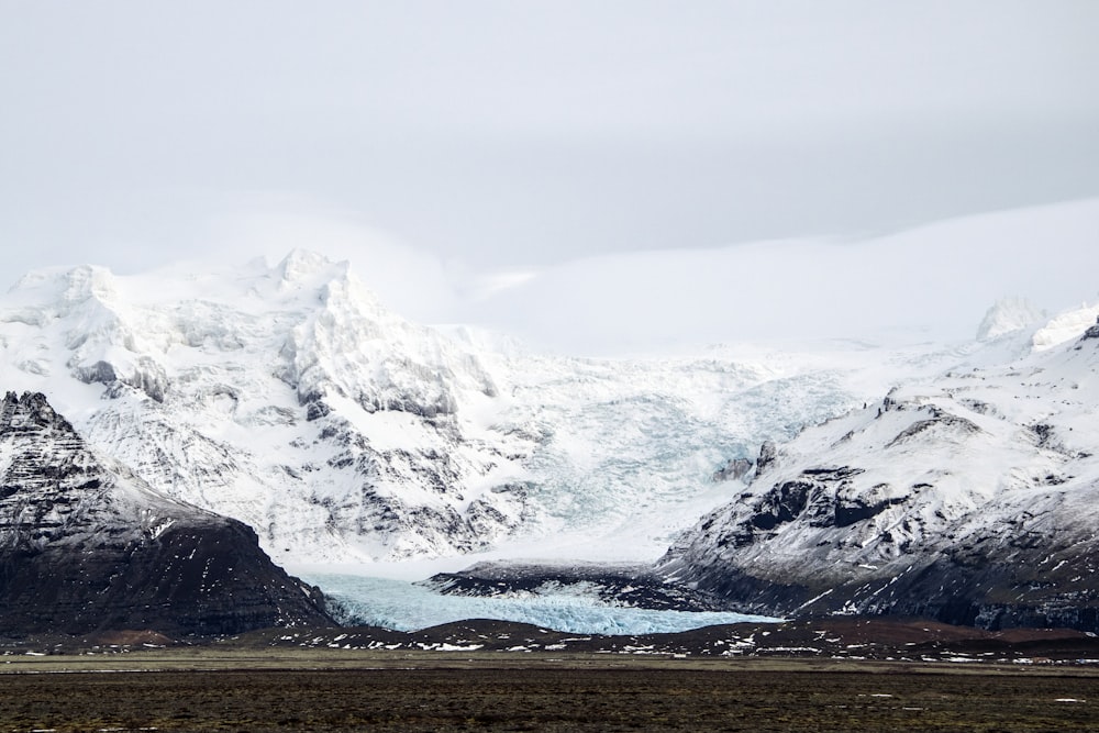 snow covered mountain during daytime