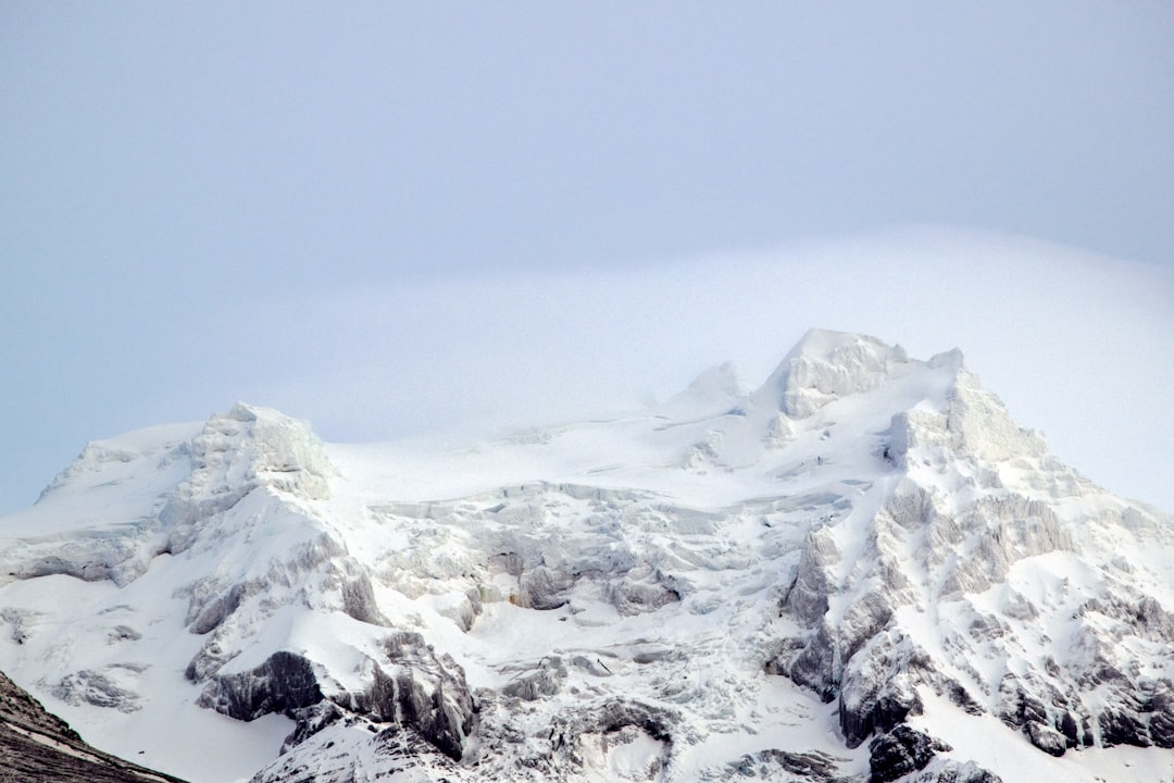 snow covered mountain under blue sky during daytime