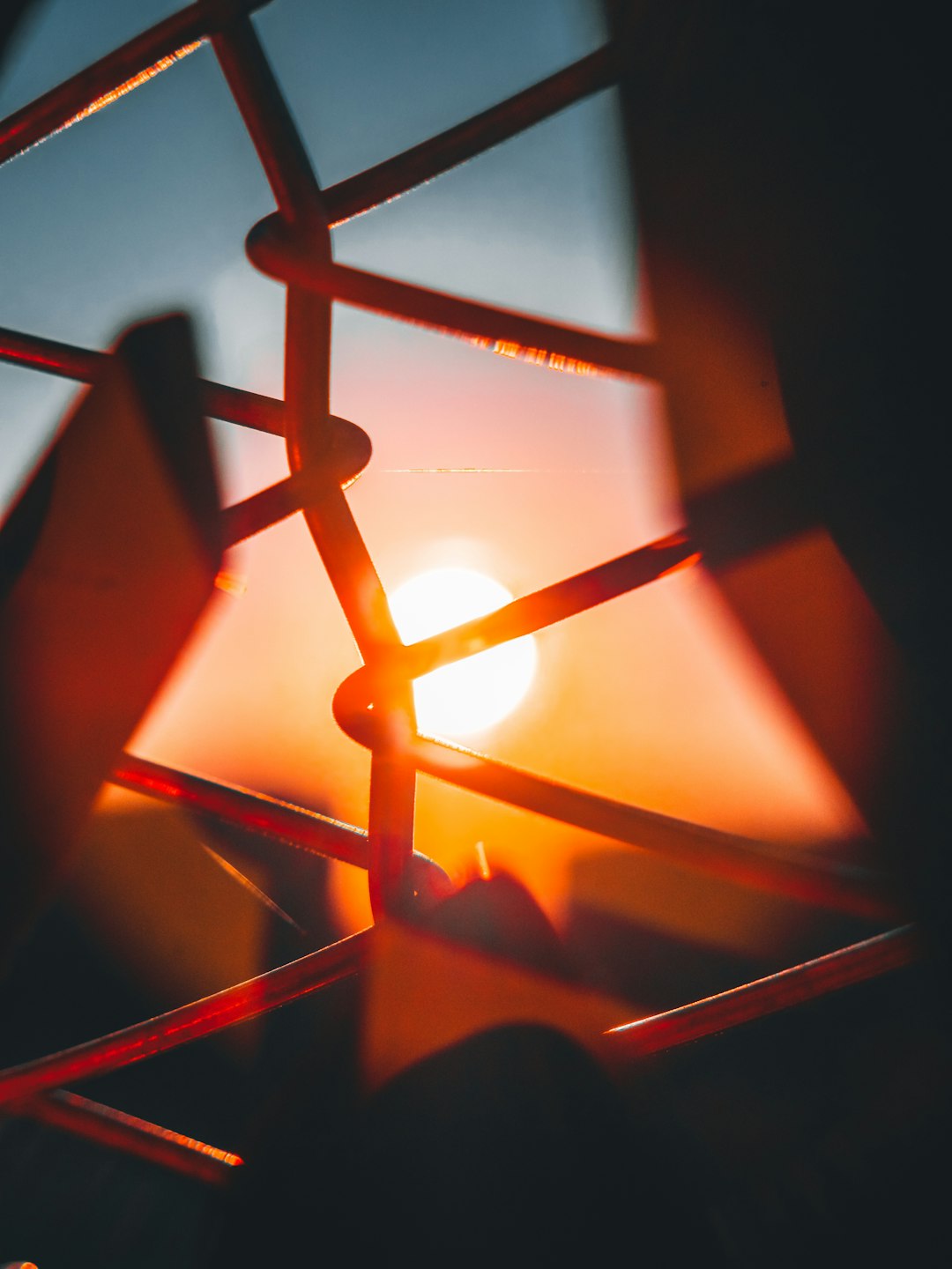 brown metal fence during sunset