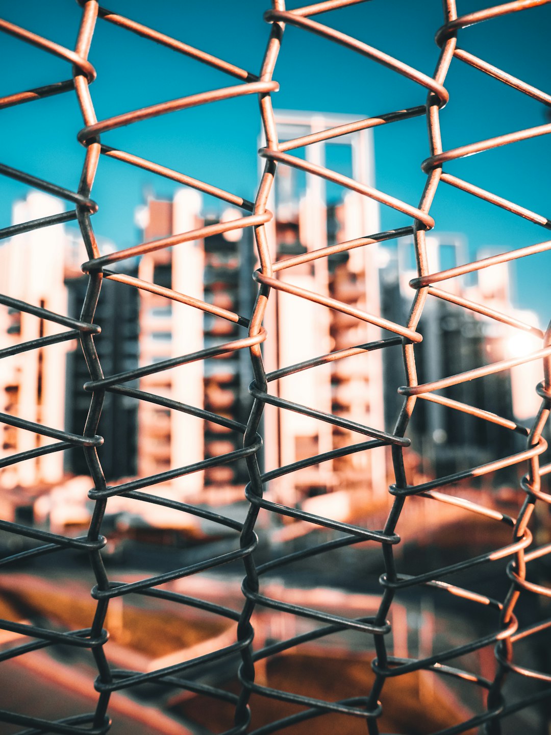 grey metal fence during daytime