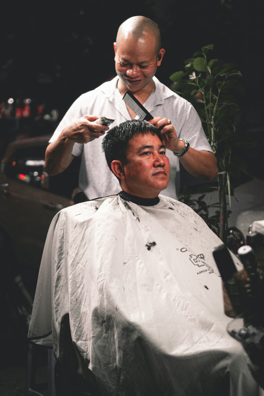 man in white shirt holding black hair brush