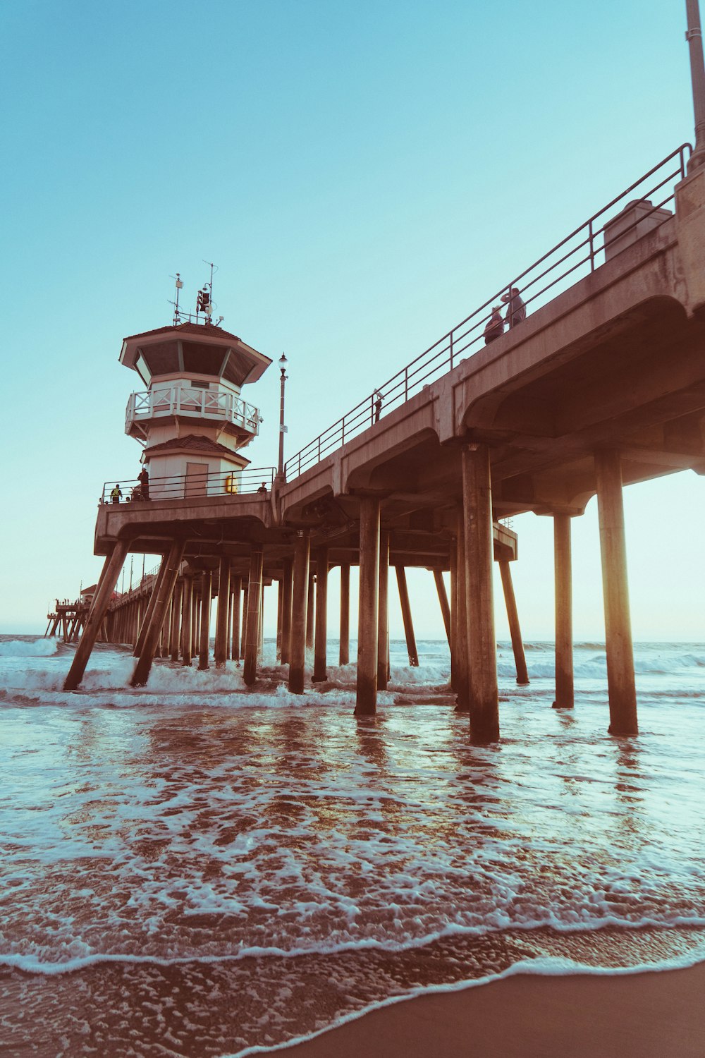 brown wooden dock on sea during daytime