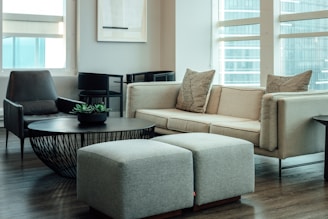 gray 2 seat sofa near round table