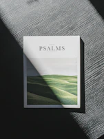 A beautifully designed ebook cover featuring a serene landscape and a woman in prayer.
