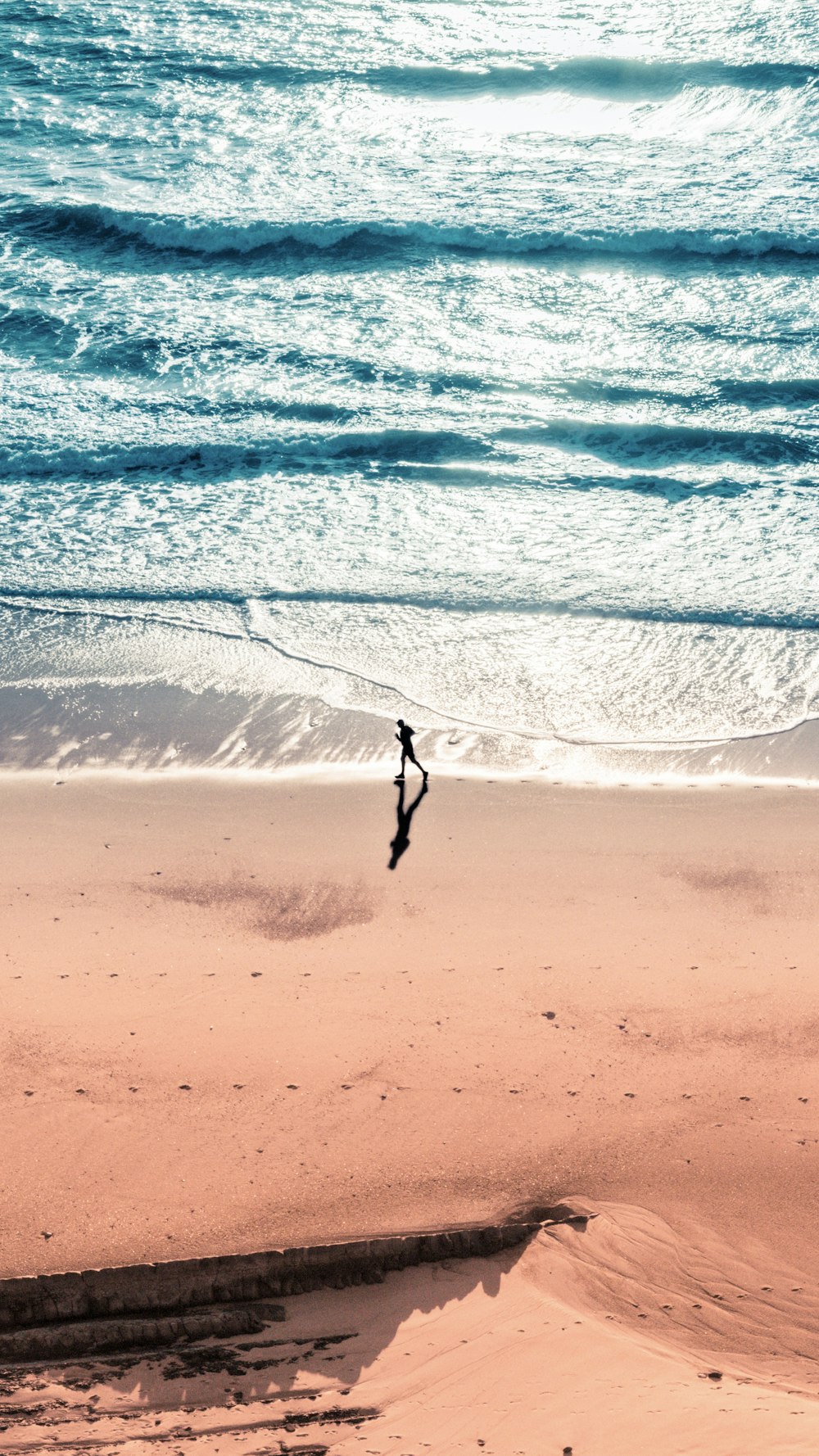 person surfing on sea waves during daytime