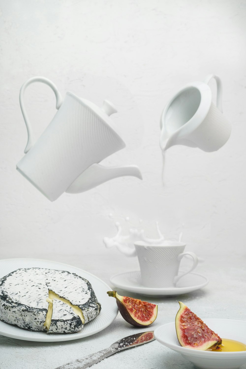 white ceramic mug on white and yellow floral ceramic plate