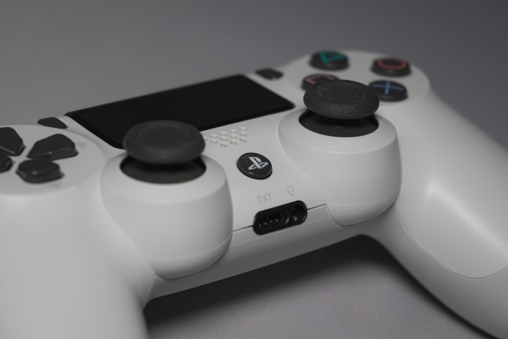 white and black game controller