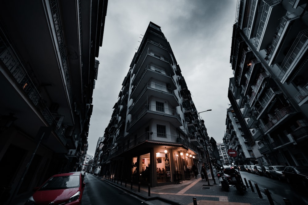 cars on road near buildings during night time