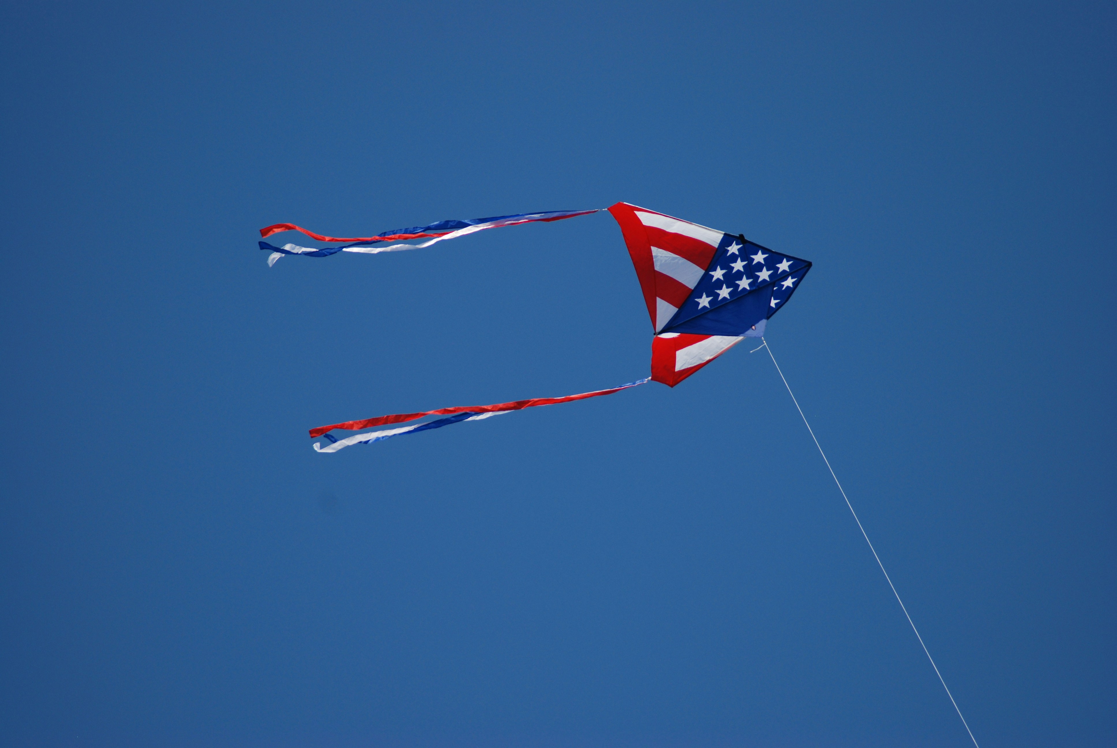 us a flag on pole during daytime