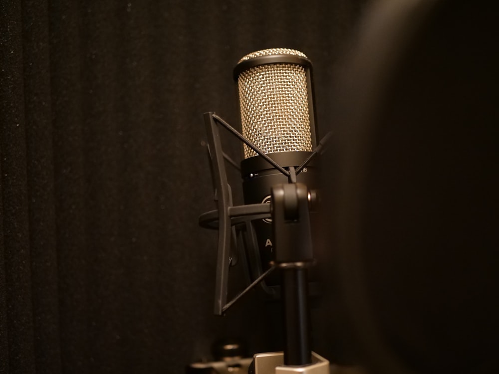 black and silver microphone on black textile