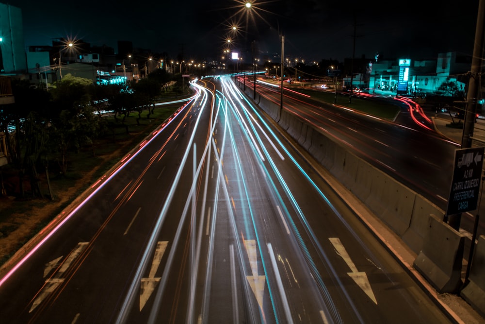 time lapse photography of cars on road during night time