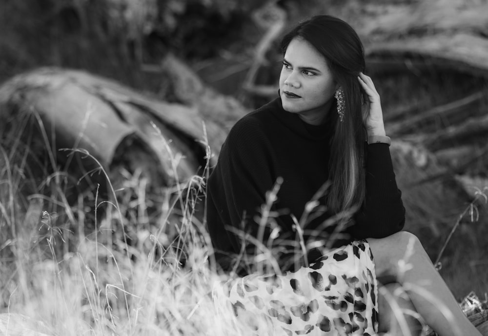 woman in black and white polka dot long sleeve shirt