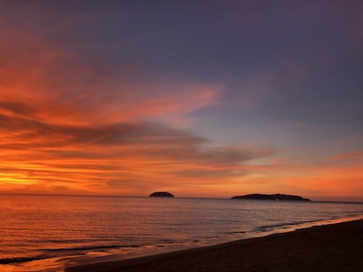 A stunning sunset view over a tropical beach, inviting wanderlust.
