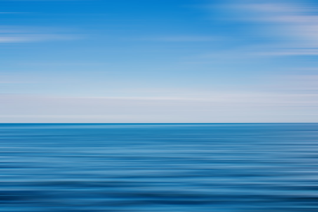 blue ocean water under blue sky during daytime