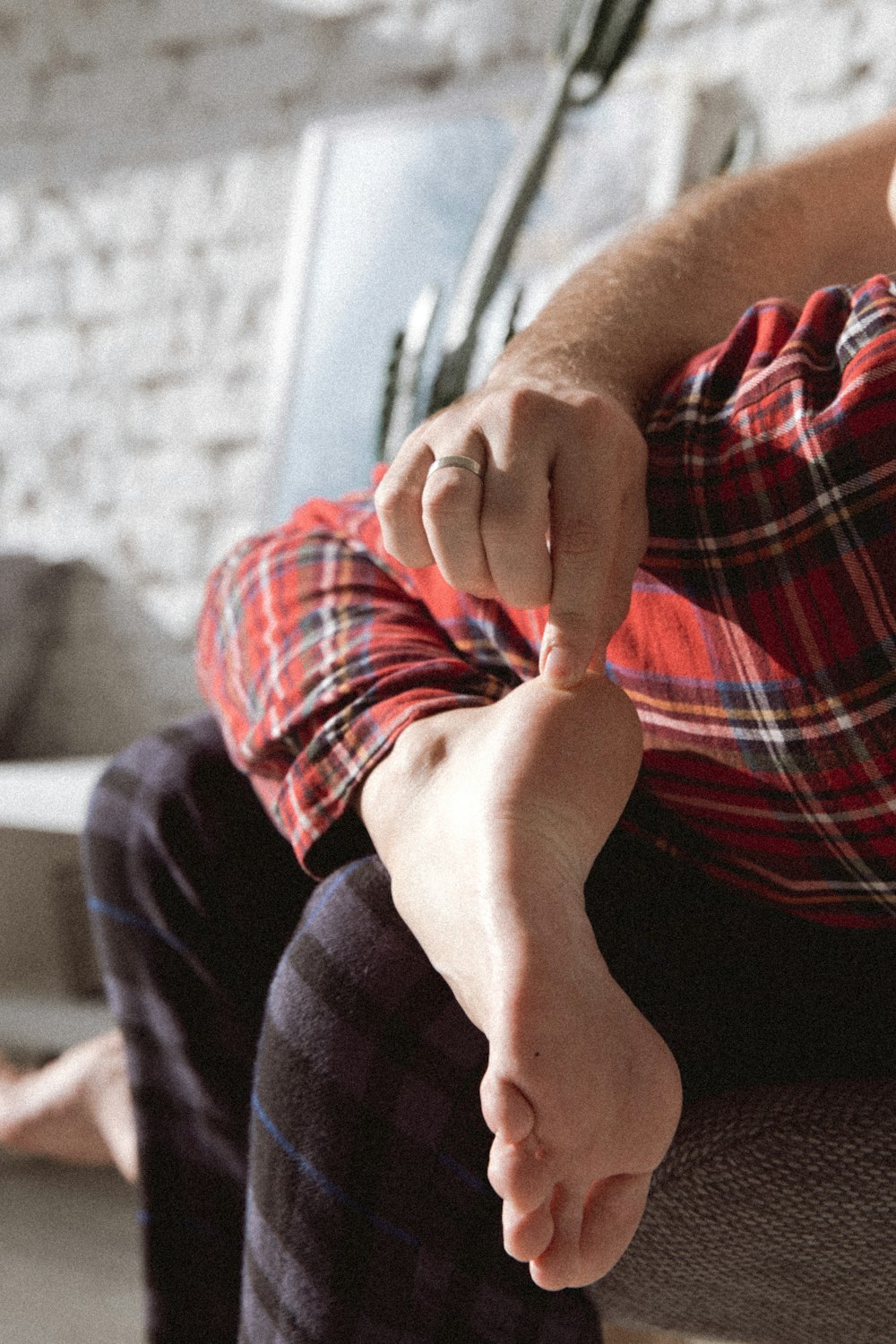 person in red white and blue plaid shirt