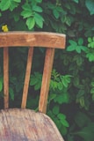 An inviting outdoor back chair cushion resting on a rustic wooden chair