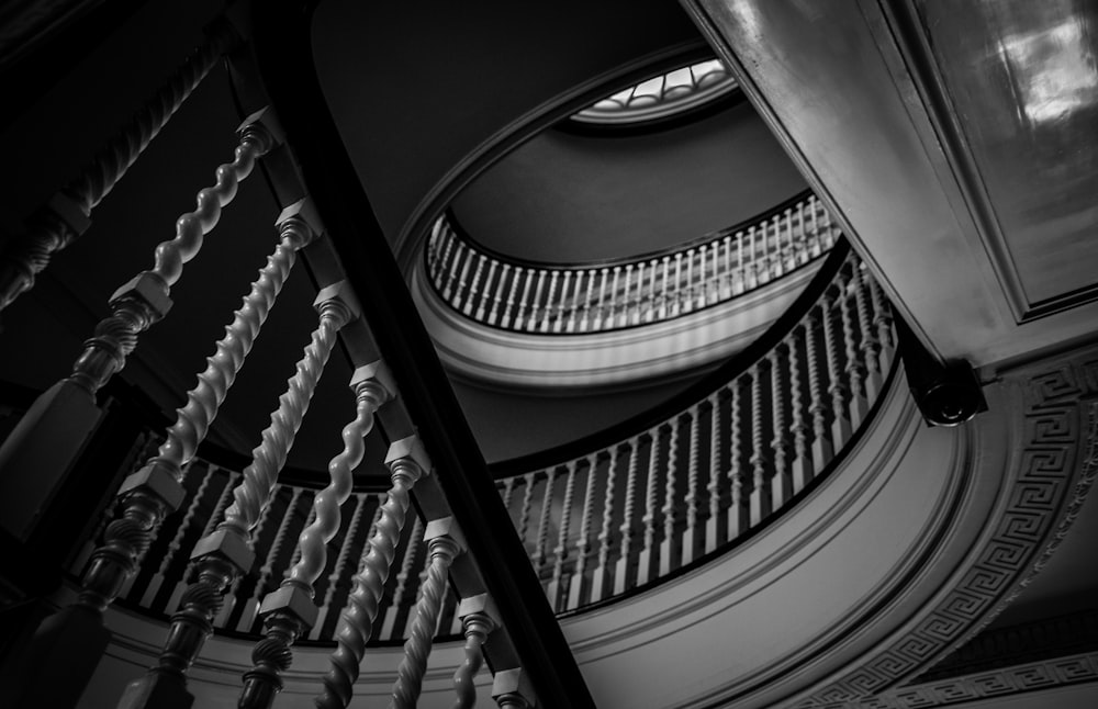 grayscale photo of spiral staircase