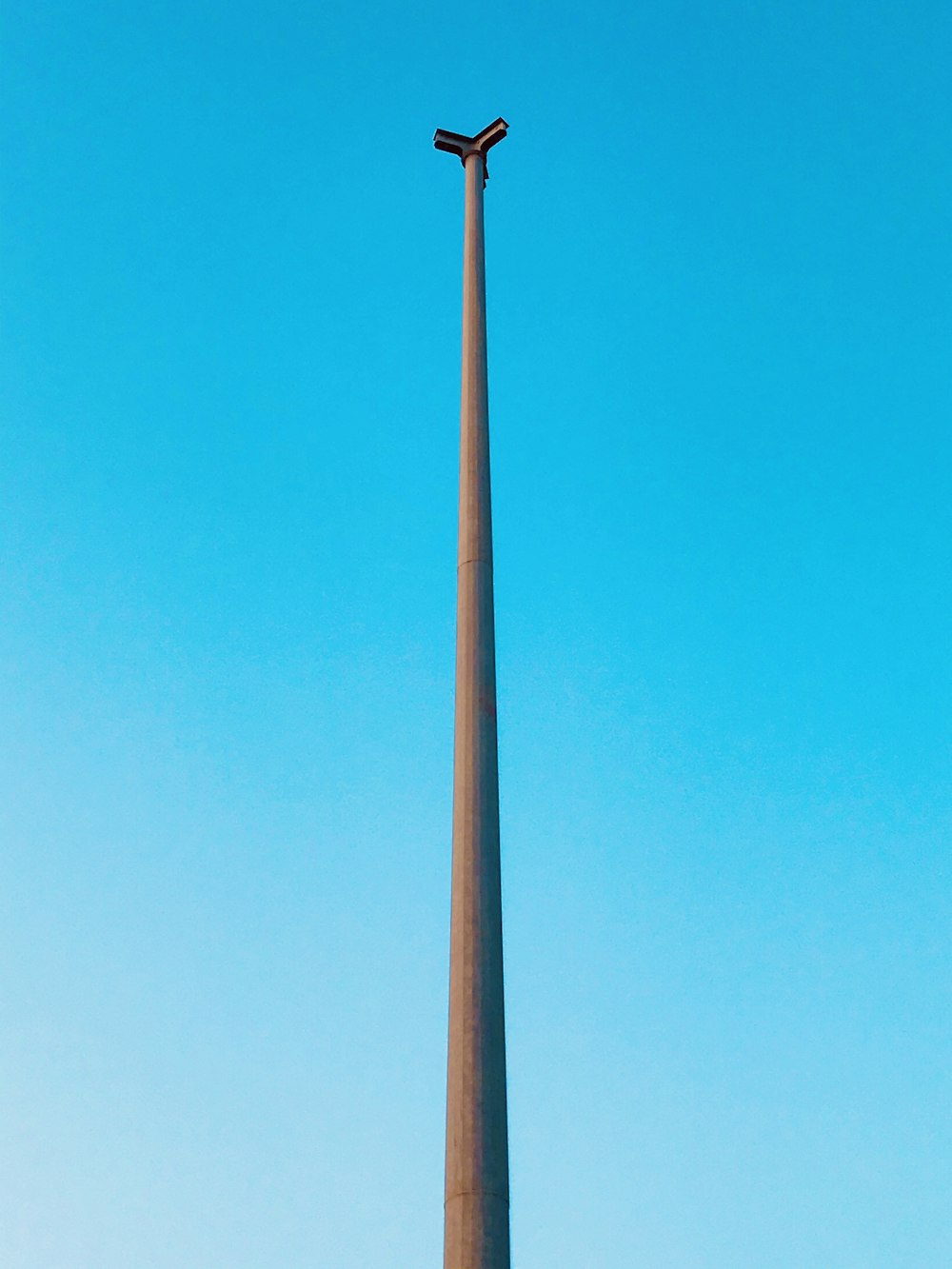 white metal pole under blue sky during daytime