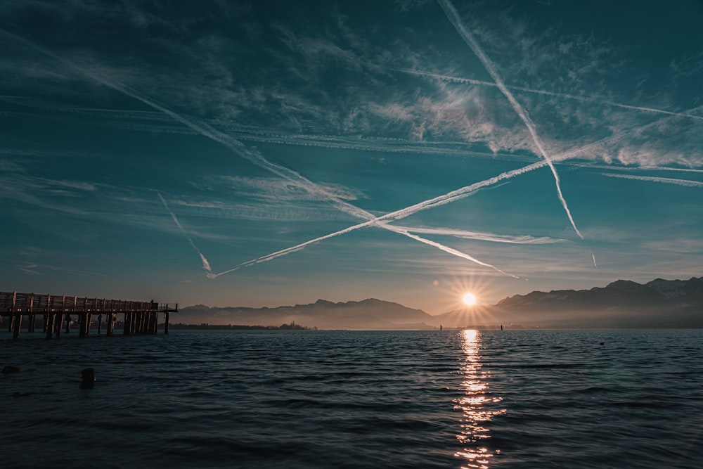 body of water during sunset