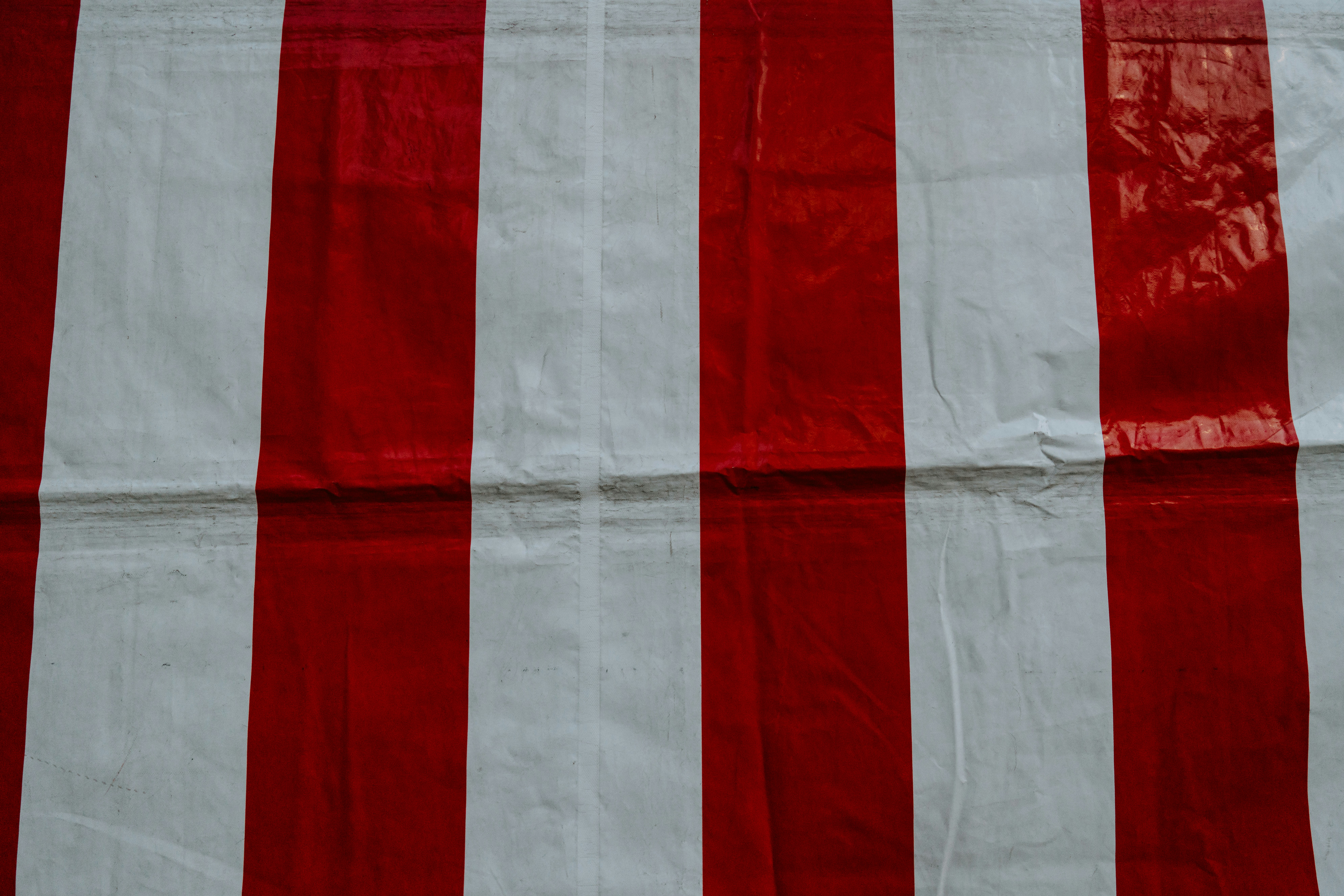 white and red striped textile