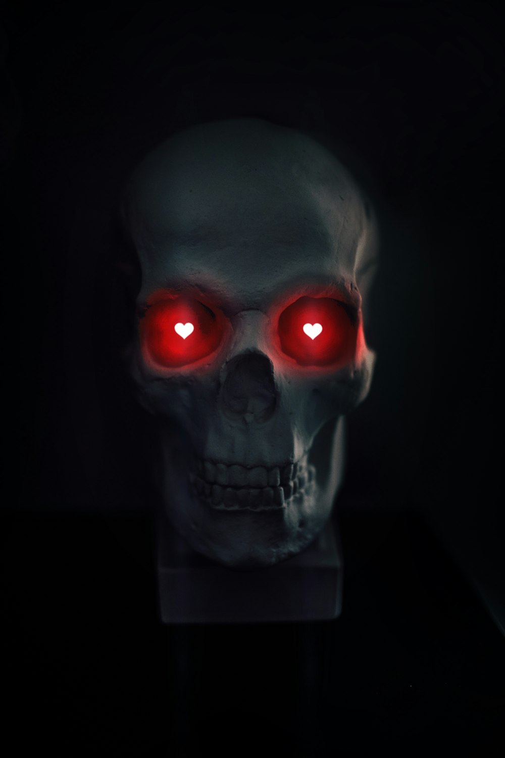 gray skull with red eyes