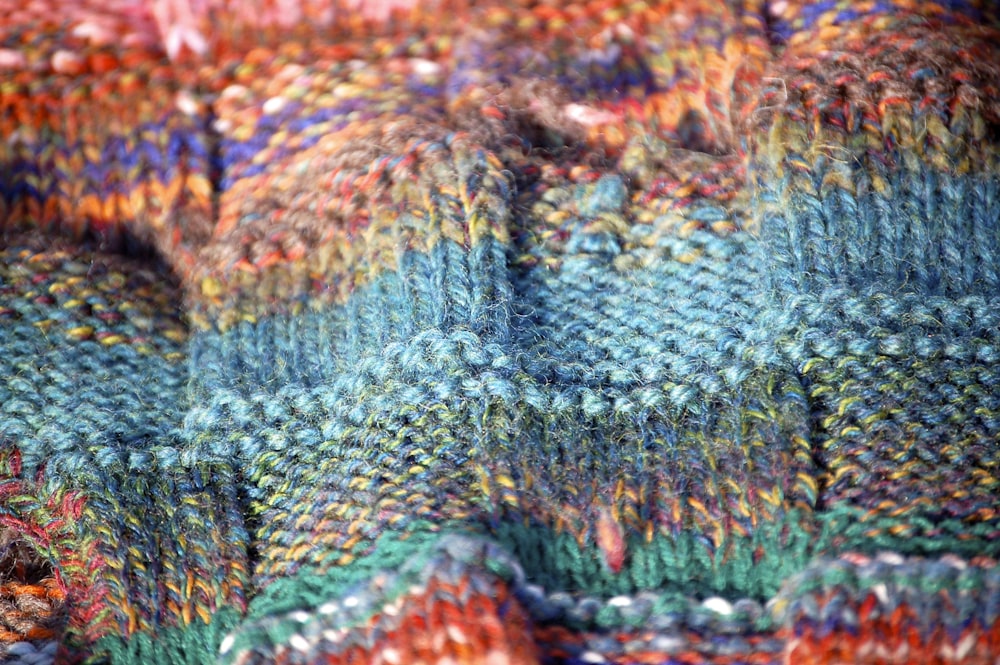 blue green and red knit textile