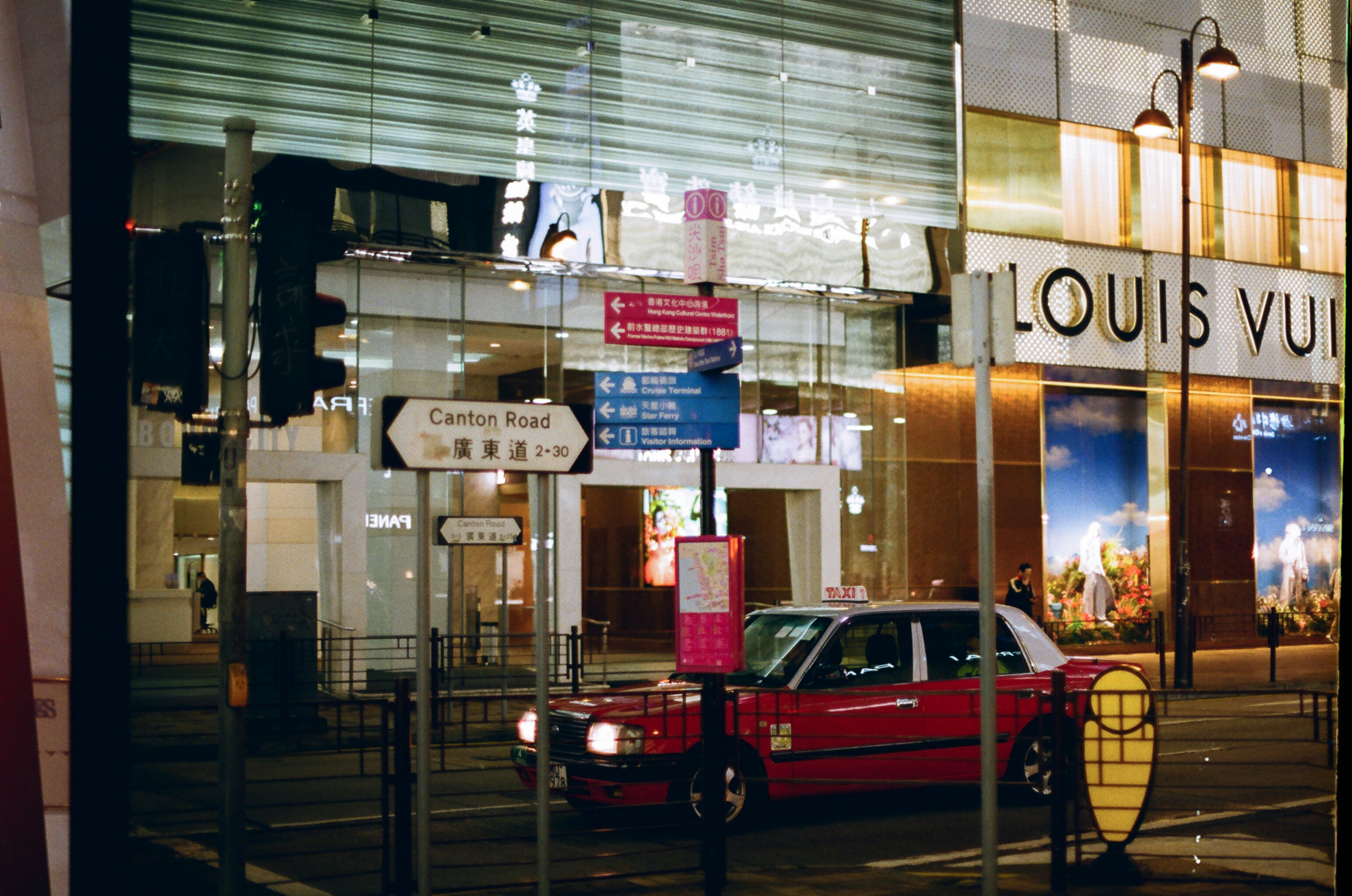 Red car parked in front of store