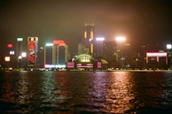 Nighttime cityscape with neon lights reflecting the duo’s urban roots.