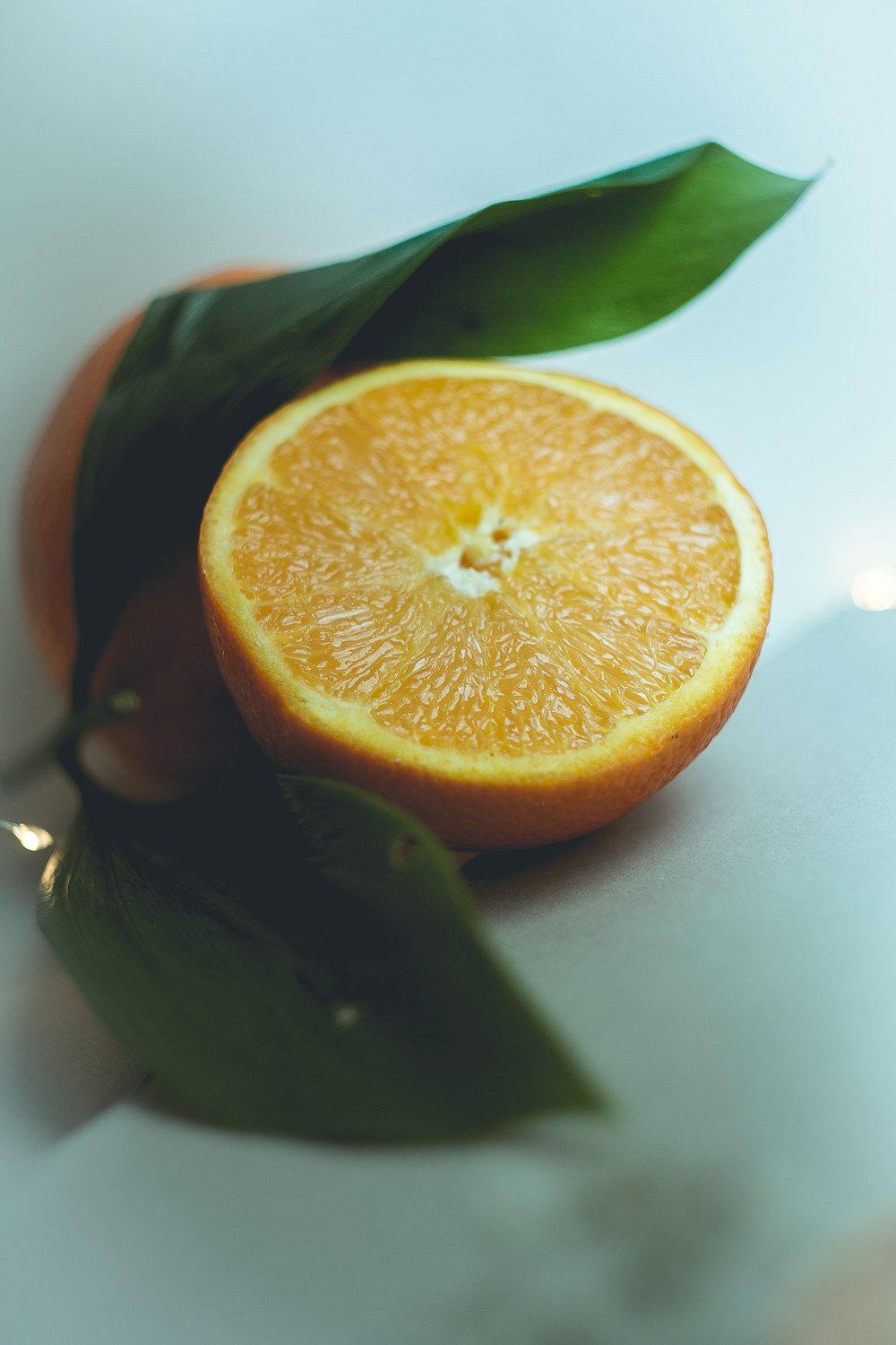 orange fruit on white table