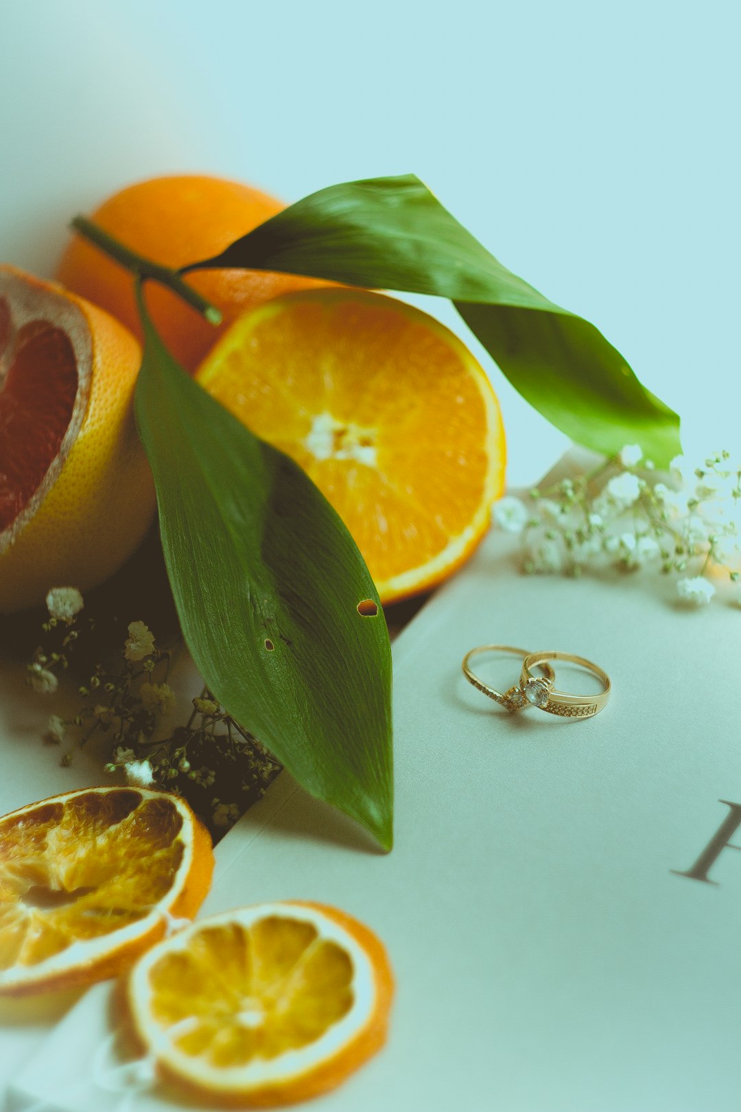 sliced orange fruit beside green leaves