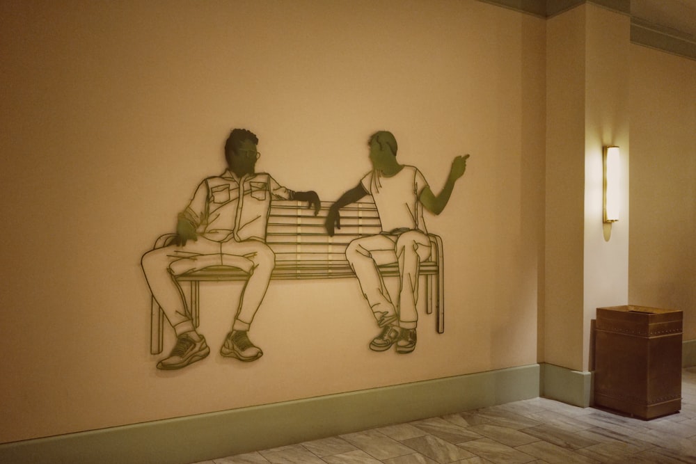 3 women sitting on white couch