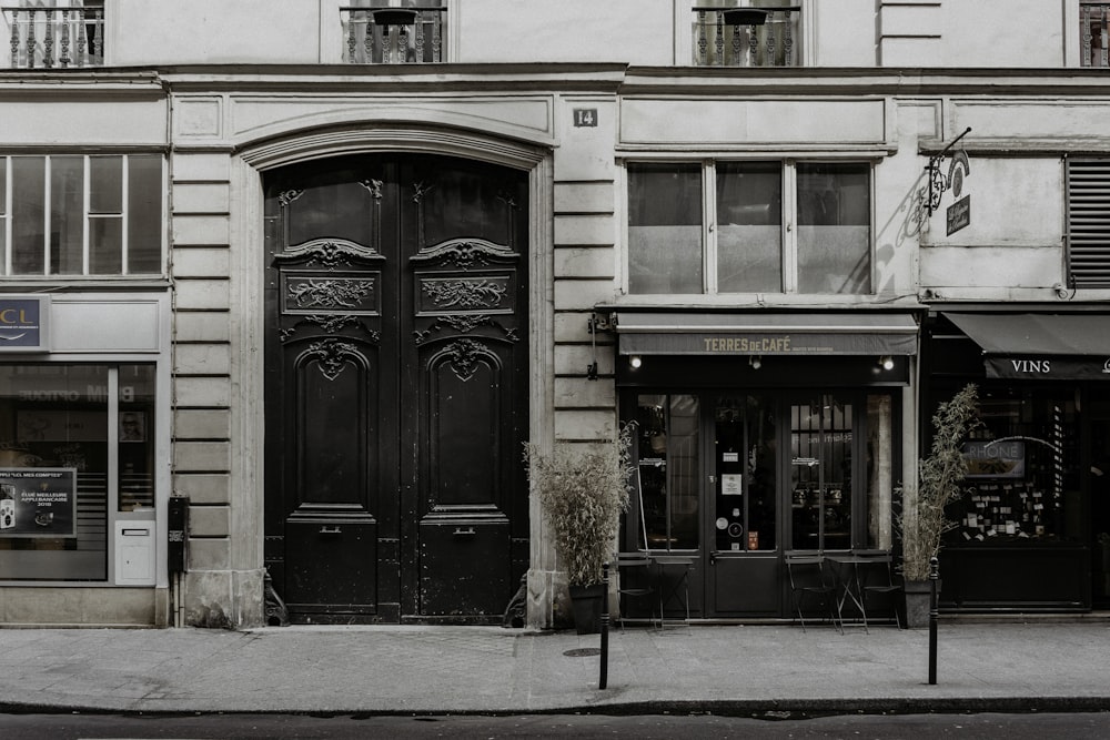 brown wooden door on gray concrete building