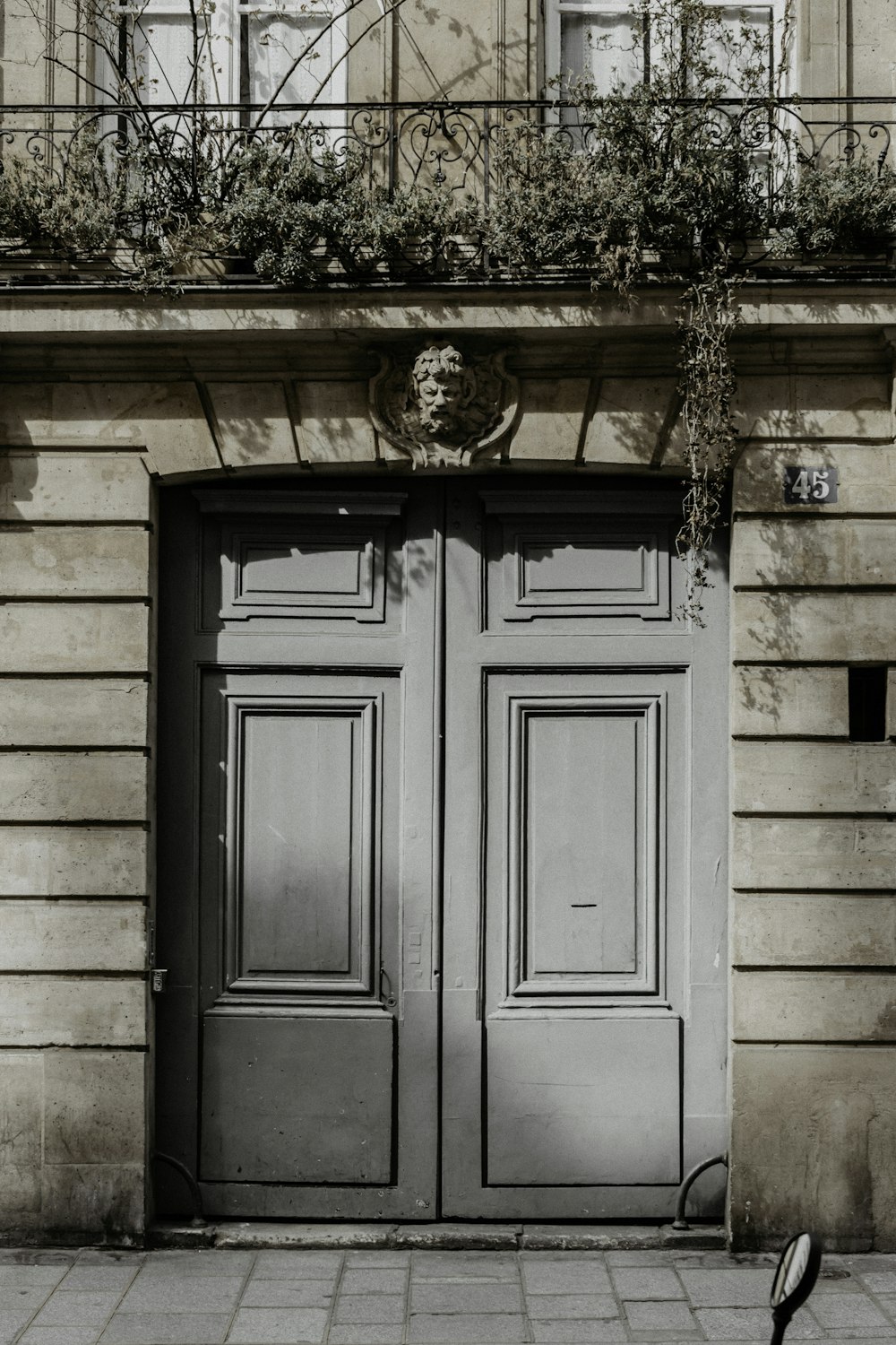 brown wooden door with brown brick wall