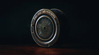 A close-up of an antique compass resting on an old map, evoking a sense of adventure and discovery.